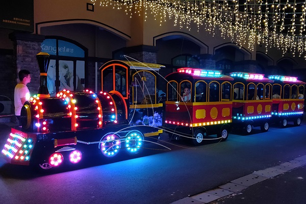 Vintage Amusement Park Trains for Sale at Night